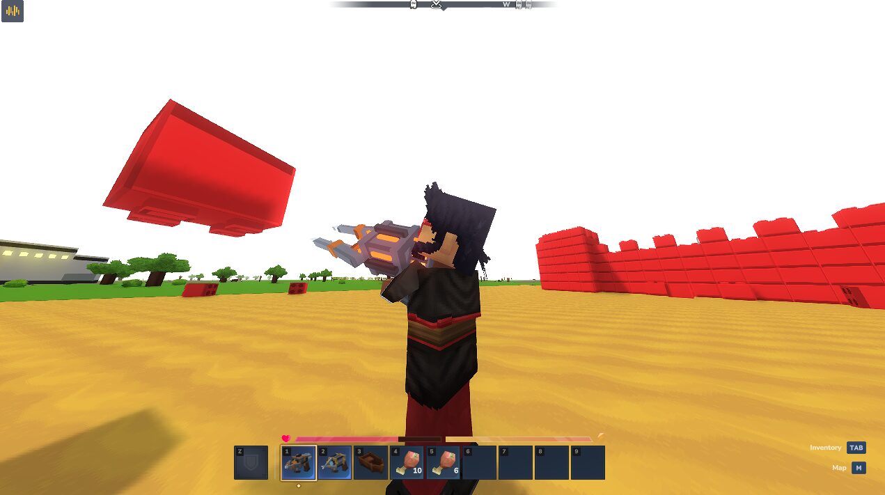 A player with the gravity gun raised as a large red block tumbles through the air beside a red brick wall.